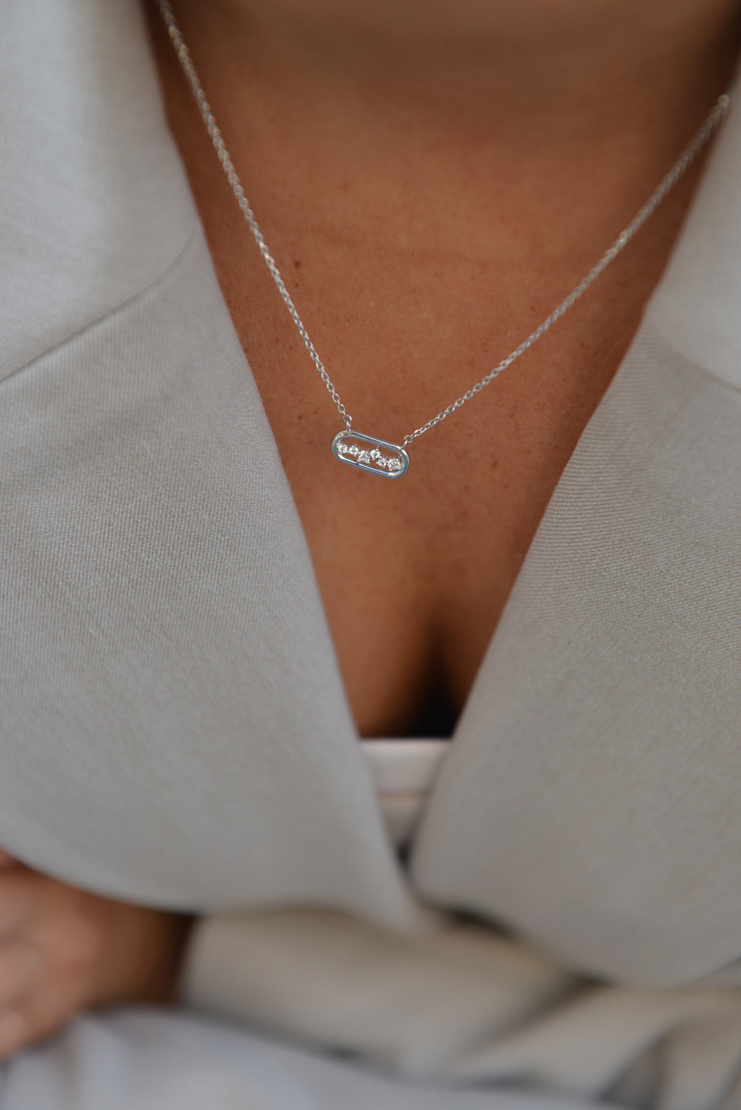 Collier argent et OZ Millenia